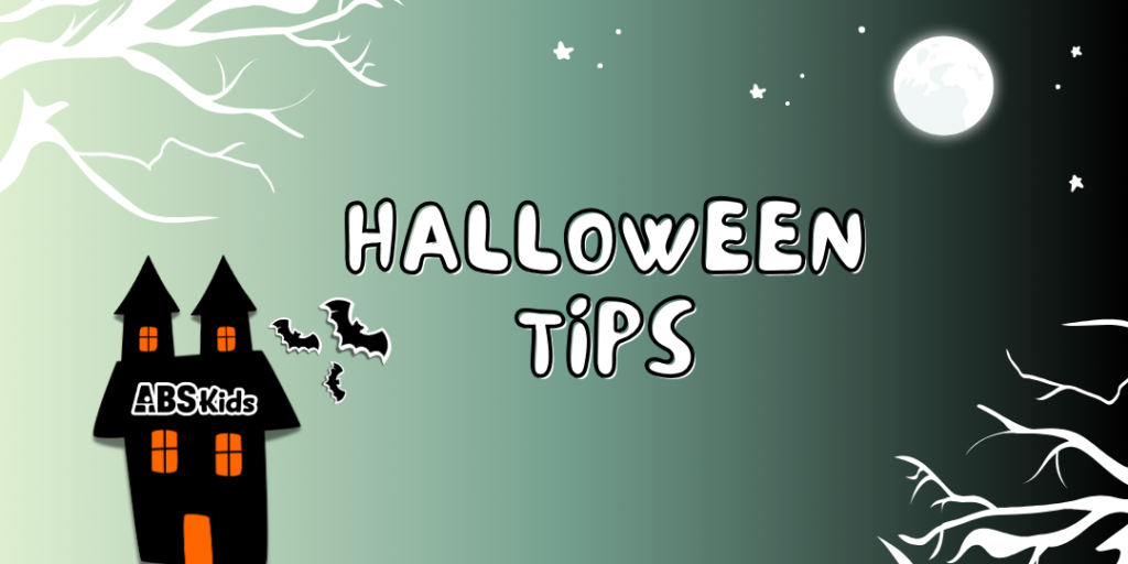 A Halloween-themed graphic with a spooky black house on the left, featuring the ABS Kids logo. Bats fly around the house, and a large full moon is visible in the upper right corner. The text 'HALLOWEEN TIPS' is displayed in playful white font with a gradient green background, decorated with bare tree branches and stars.