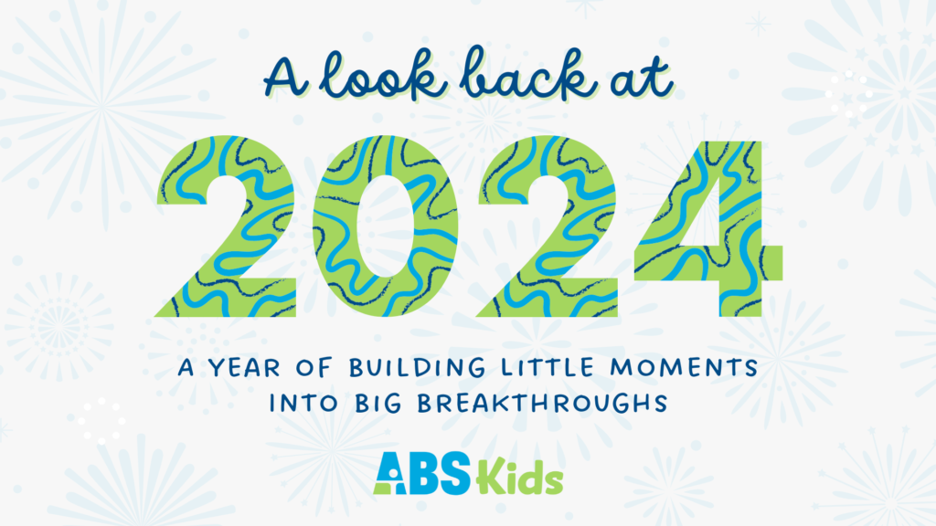 A year-end recap image with the text 'A look back at 2024, A Year of Building Little Moments into Big Breakthroughs.' The ABS Kids logo is featured at the bottom, with fireworks in the background and colorful 2024 text with a swirl pattern. Keywords: ABS Kids, 2024, recap.