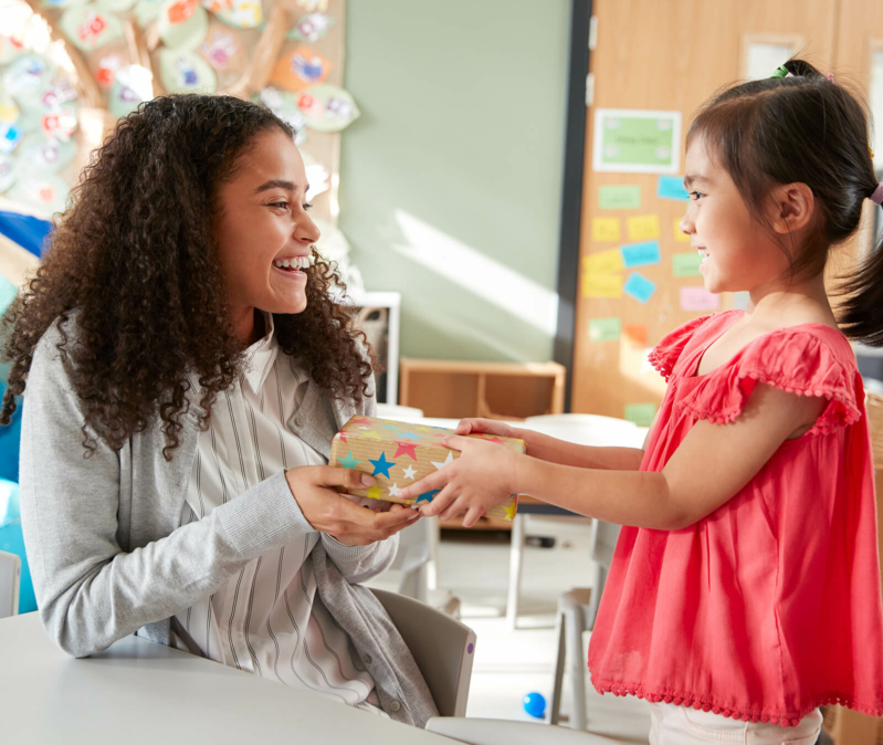 child giving behavior technician a gift