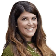 The image shows Chanti Waters, a professional with long, wavy brown hair, smiling warmly at the camera. She is wearing a green top and a necklace, with a friendly and approachable expression.